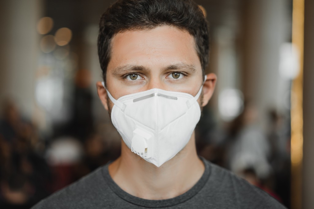 Close up portrait of men in respirator mask at the airport coronavirus covid 19 and air pollution t20 nlzbao